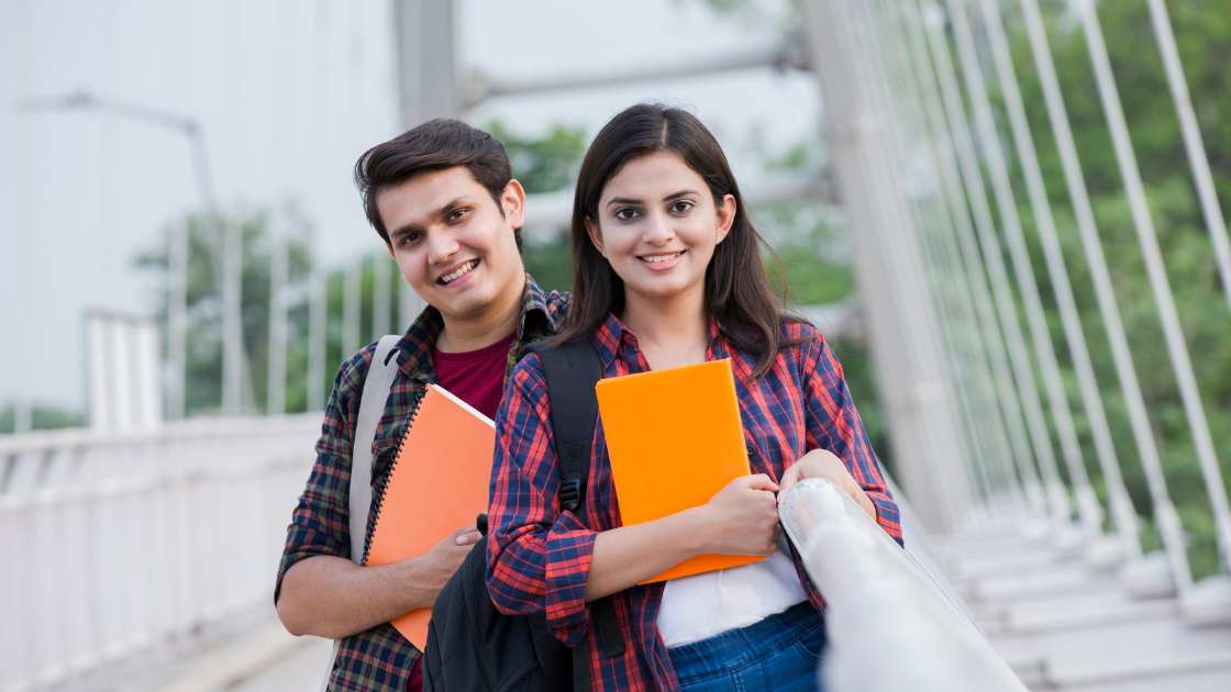 A diverse group of international students holding IELTS textbooks, symbolizing the global importance of the IELTS exam for education and career opportunities.